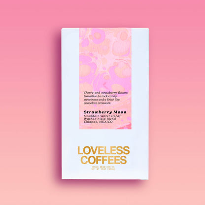 Decaf coffee packaging for 'Strawberry Moon' with a color block design in pink and red on the upper part of the packaging, and the brand name 'LOVELESS COFFEES' in bold, gold letters on the lower part. Product information is presented on a pink background.