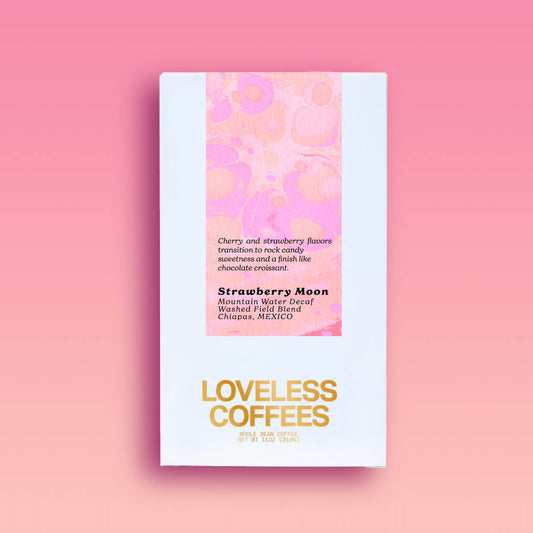 Decaf coffee packaging for 'Strawberry Moon' with a color block design in pink and red on the upper part of the packaging, and the brand name 'LOVELESS COFFEES' in bold, gold letters on the lower part. Product information is presented on a pink background.